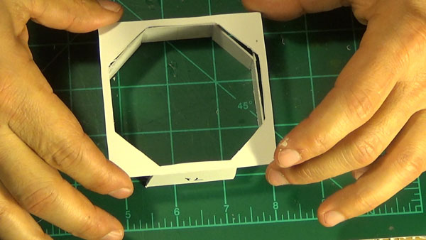 Gluing the octagon port top face in place.